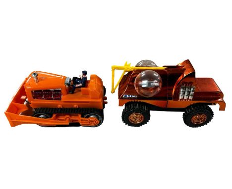 A pair of boxed battery-operated toys, one by Marx