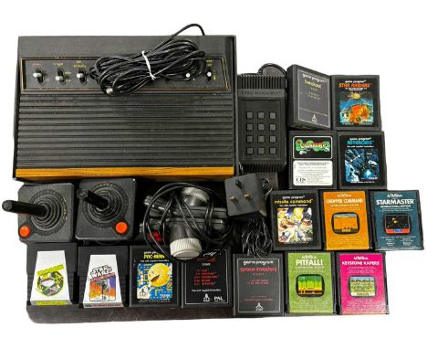 An Atari console, together with a quantity of games, controllers etc