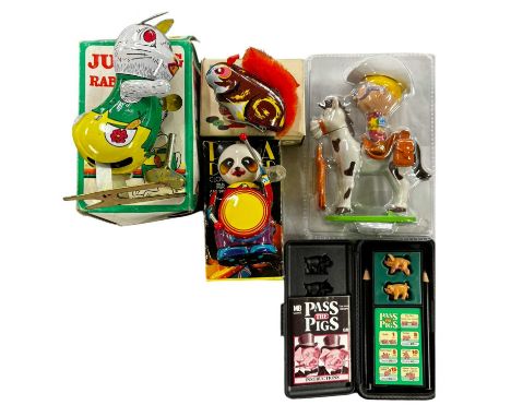 A mixed lot of vintage toys, to include 3 x boxed Chinese tinplate clockwork animals, Milkybar Kid figure and Pass the Pigs g