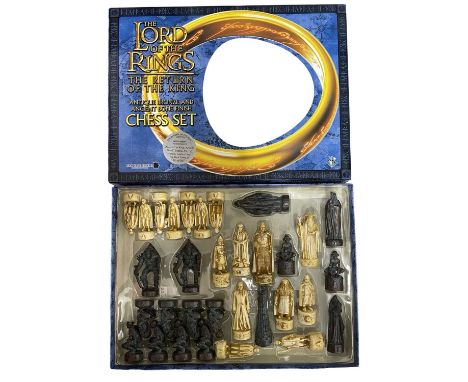 A boxed Lord of the Rings: The Return of the King antique bronze and antique bone-effect finish chess set.