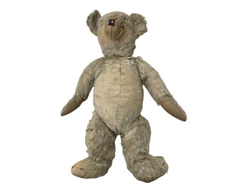 A vintage, well-loved teddy bear. Length approximately: 48cm