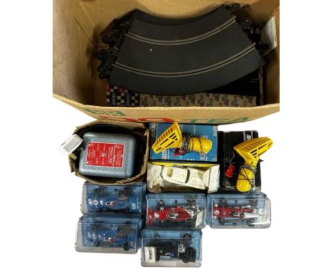 A collection of vintage Scalextric track, cars, controllers etc