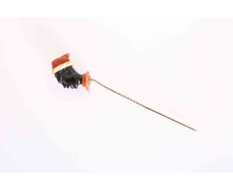 A STICK PIN FORMED AS A BLACKAMOOR'S HEAD. 8cm