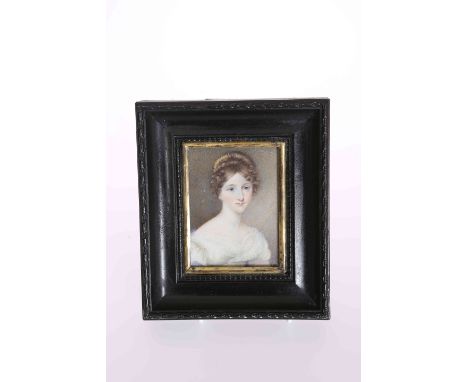 A PORTRAIT MINIATURE OF A YOUNG LADY, EARLY/MID 19TH CENTURY, on ivory, wearing lace decorated dress and hair adornment, in a