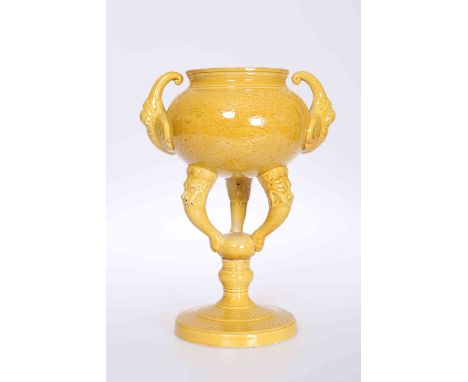 A CHINESE YELLOW GROUND CENSER, with twin handles and sgraffito type decoration of dragons and flaming pearls, raised on a tr