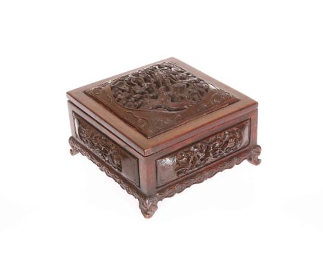 A GOOD CHINESE CARVED HARDWOOD BOX, square section, the lift-off cover with domed fret carved panel depicting dragon, fish an