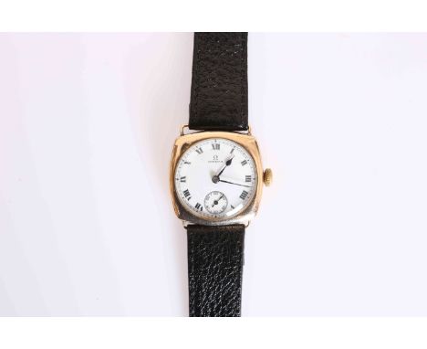 AN ART DECO PERIOD OMEGA 9 CARAT GOLD GENTLEMAN'S CUSHION SHAPED WRISTWATCH, white enamel dial with Roman numerals and subsid