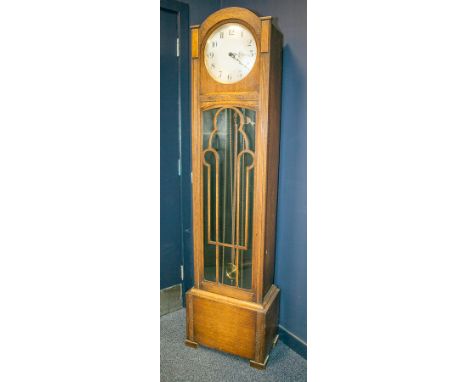 ENGLISH 1930s CARVED OAK LONGCASE CLOCK
of small proportions, the unsigned triple weight movement striking on gongs, the 10.5