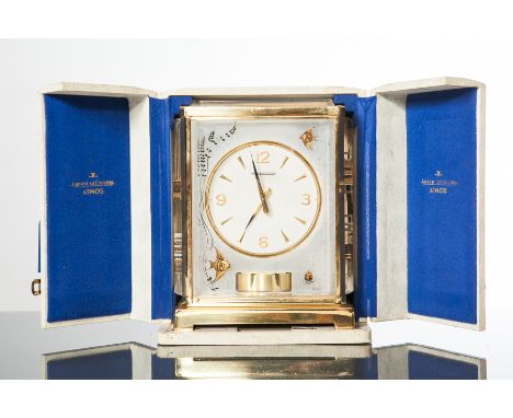 JAEGER-LECOUTRE GILT BRASS SWISS MARINA ATMOS CLOCK 
signed Atmos movement, the circular dial with applied Arabic numeral and