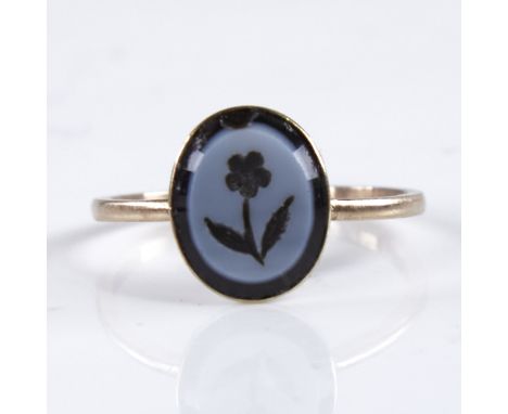 A 19th century unmarked gold intaglio banded agate seal ring, depicting flower, with closed-back setting, setting height 10.9