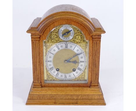 A late 19th/early 20th century German light oak-cased dome-top mantel clock, by Lenzkirch, architectural style case with pill