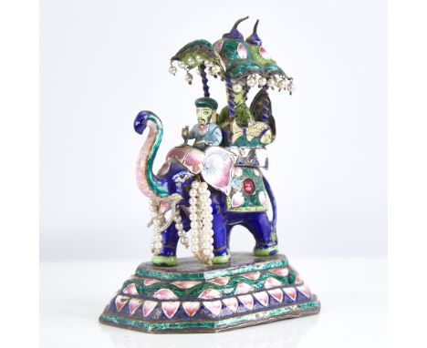 An early 20th century Indian unmarked silver and enamel caparisoned elephant model, with howdah and 2 passengers, height 12cm