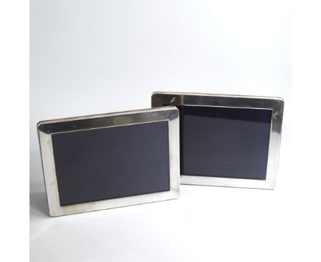 A pair of Elizabeth II silver-fronted rectangular photo frames, with velvet backings and strut stands, by Kitney & Co, hallma