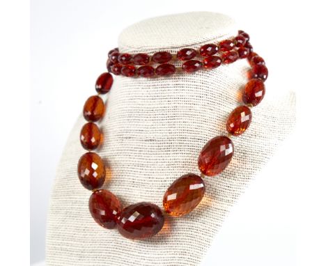 A Vintage graduate single-row faceted amber bead necklace, beads measuring from 29.8mm to 11.5mm, necklace length 94cm, 74gVe