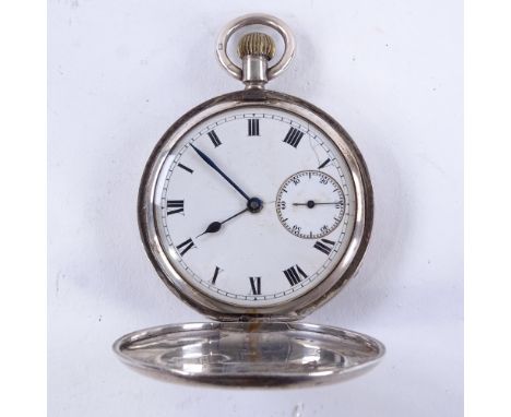 An early 20th century silver full hunter pocket watch, white enamel dial with black Roman numeral hour markers, blued steel h