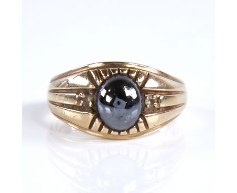 A large 9ct gold cabochon haematite and paste signet ring, setting height 13.1mm, size X, 6.9gGood overall condition, haemati