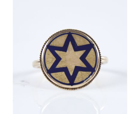 A 19th century unmarked gold blue enamel star insignia panel ring, within rope twist surround, panel diameter 16.5mm, size L,