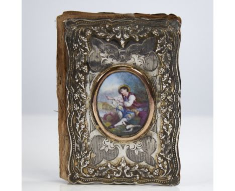 A 19th century Continental unmarked silver lady's notecase, allover relief embossed and engraved grapevine decoration with in