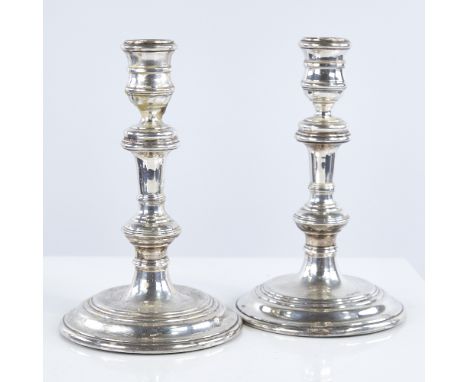 A pair of Elizabeth II silver table candlesticks, in George I style, by William Comyns & Sons Ltd, hallmarks London 1958, hei