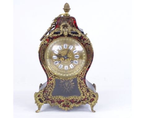 A 19th century French tortoiseshell and brass boulle work 8-day mantel clock, shaped case with glass pendulum viewing panel, 