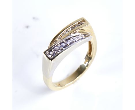 A modern 14ct gold tanzanite and diamond dress ring, setting height 6.9mm, size N, 5.4gExcellent original condition, all ston