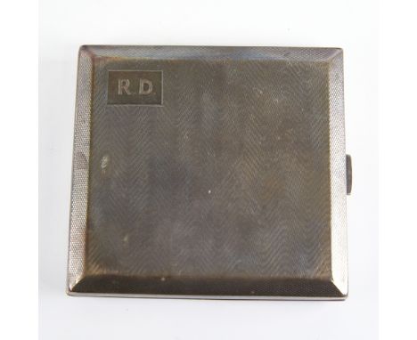A George V Art Deco silver cigarette case, square form with wavey engine turned decoration and gilt interior, by William Neal
