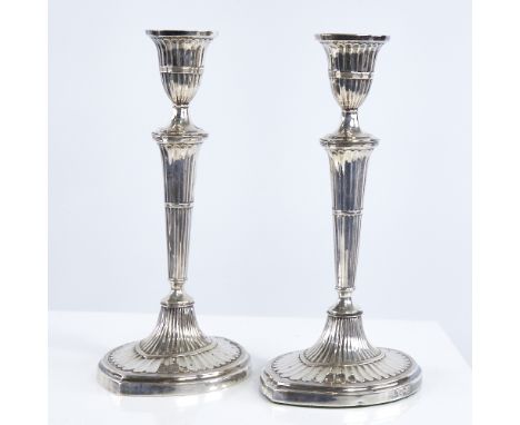 A pair of late Victorian silver table candlesticks, navette form with allover fluted decoration and reeded borders, by Martin
