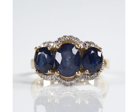 A modern 14ct gold sapphire and diamond triple-halo cluster ring, set with oval-cut sapphires and round brilliant-cut diamond