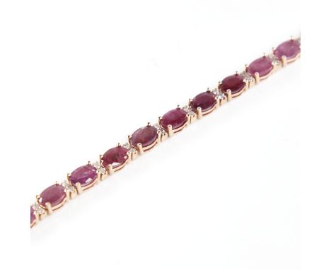 A modern 14ct rose gold ruby and diamond line bracelet, set with oval-cut rubies with double round brilliant-cut diamond spac