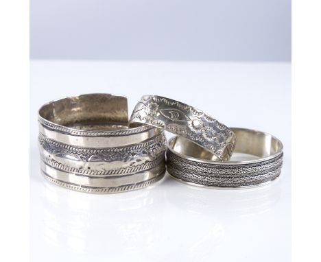 3 large Scandinavian silver torque bangles, largest band width 35.1mm, internal diameter 66mm, 147.5g total (3)All in good or