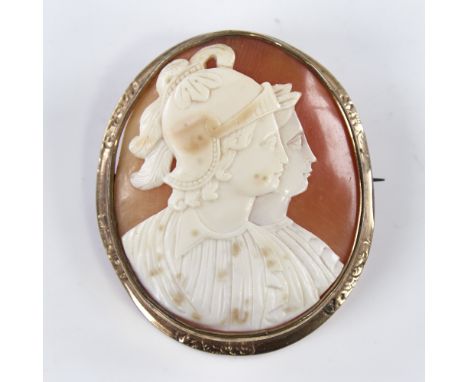 A 19th century relief carved shell cameo brooch, depicting 2 Classical profiles, in pinchbeck frame, brooch height 56.8mm, 23