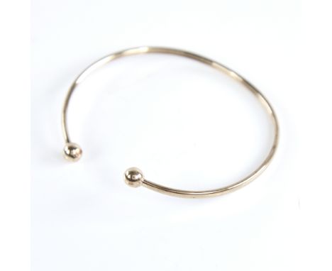 An unmarked gold torque bangle, tests as 9ct, band width 2.5mm, internal length 53mm, internal height 45mm, 2.3gExcellent ori