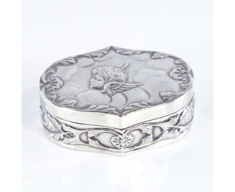 A late Victorian Art Nouveau silver dressing table box and cover, oval form with relief embossed cherub decoration, by Willia