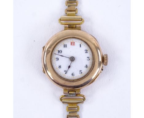 An early 20th century lady's 9ct rose gold mechanical wristwatch, white enamel dial with Arabic numerals and 15 jewel Dreadno