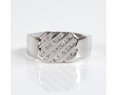 A modern 9ct white gold diamond signet ring, channel set with round brilliant-cut diamonds, total diamond content approx 0.25