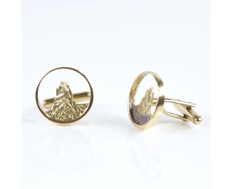 A modern pair of Continental 18ct gold mountain cufflinks, pierced and textured panels, maker's marks CW, panel diameter 16.6