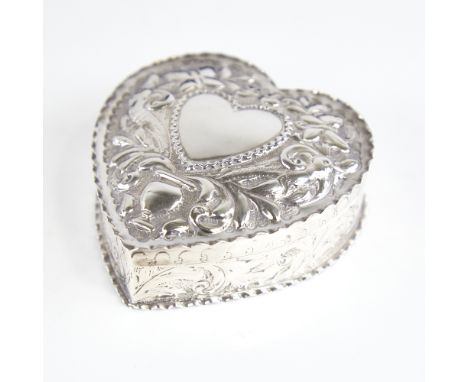 A Victorian silver heart-shaped trinket box and cover, relief embossed bird and foliate decoration, by William Comyns & Sons,