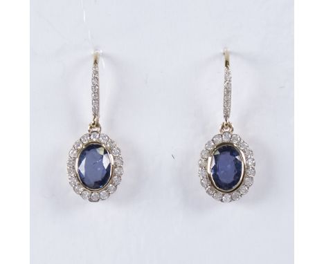 A modern pair of 14ct gold sapphire and diamond cluster drop earrings, central oval-cut sapphires surrounded by round brillia