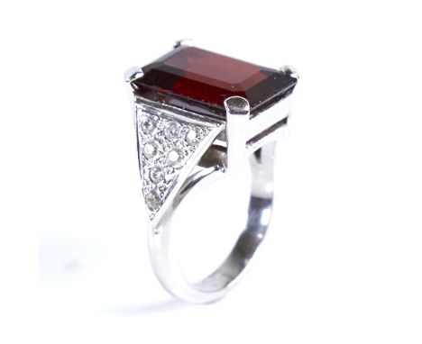 A modern 9ct white gold garnet and spinel dress ring, set with large emerald-cut garnet and eight-cut spinel cluster shoulder