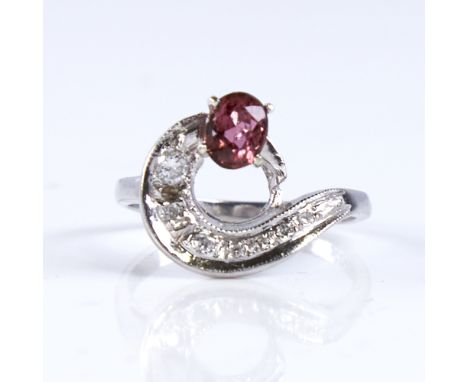 A late 20th century 14ct white gold pink tourmaline and diamond cocktail ring, set with oval mixed cut tourmaline and round c