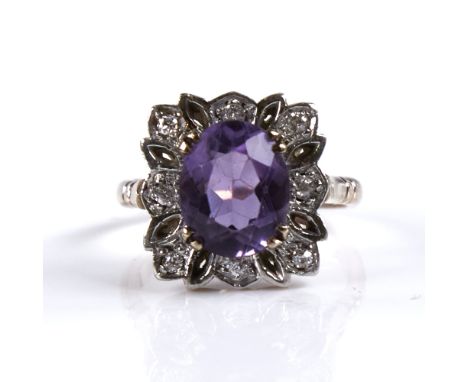 A late 20th century 9ct gold amethyst and diamond cluster dress ring, set with oval-cut amethyst and old European-cut diamond