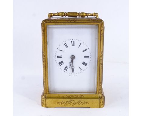 A 19th century French brass 8-day striking carriage clock, by Jules of Paris, white enamel dial with black Roman numeral hour