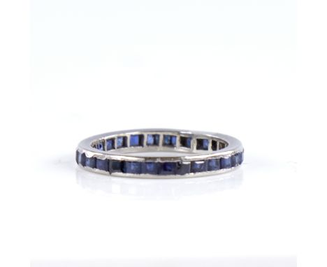 A late 20th century 18ct white gold sapphire eternity ring, set with calibre-cut sapphires, maker's marks FRS Ltd, hallmarks 