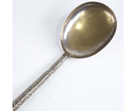 A large Indian unmarked white metal serving spoon, relief embossed foliate handle, length 26cm, 1.6ozGood overall condition, 