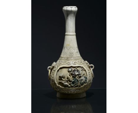 An ivory flask China, Qing Dynasty, 19th Century Big carving in high-relief, partially gilded and colored. h 30 cm Start Pric