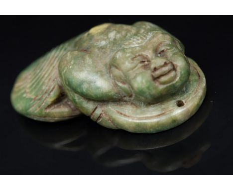 A small Chinese jade sculpture China, 19th century Depicting a fantastic being with a human head and body and fish tail; it h