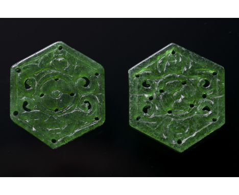 A pair of hexagonal jadeite jade plaques China, 20th Century Bright green jadeite hexagonal carvings. h 3,5 cm Start Price: €