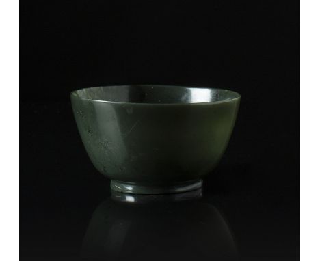 A spinach green jade bowl China, 20th Century A conical-shaped bowl with smooth slender walls. Diametro 11 cm Start Price: €8