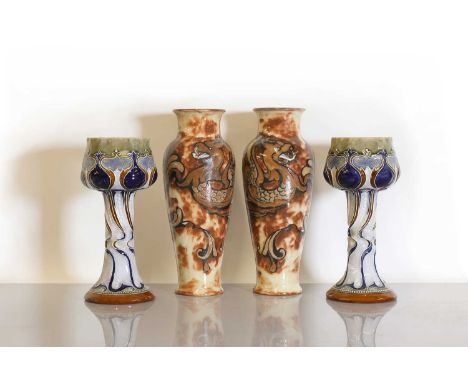 A pair of Doulton Lambeth stoneware vases,by Mark V Marshall, each of tulip form, with deeply stylised Art Nouveau scrolling,