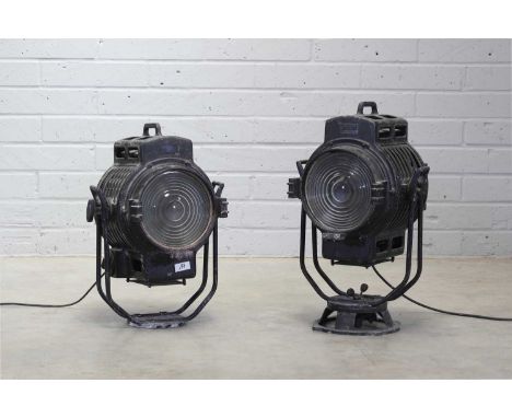 Two similar vintage aluminium theatre spotlights,each with a black finish, mounted on a swivel bracket, labelled 'Arri' to th